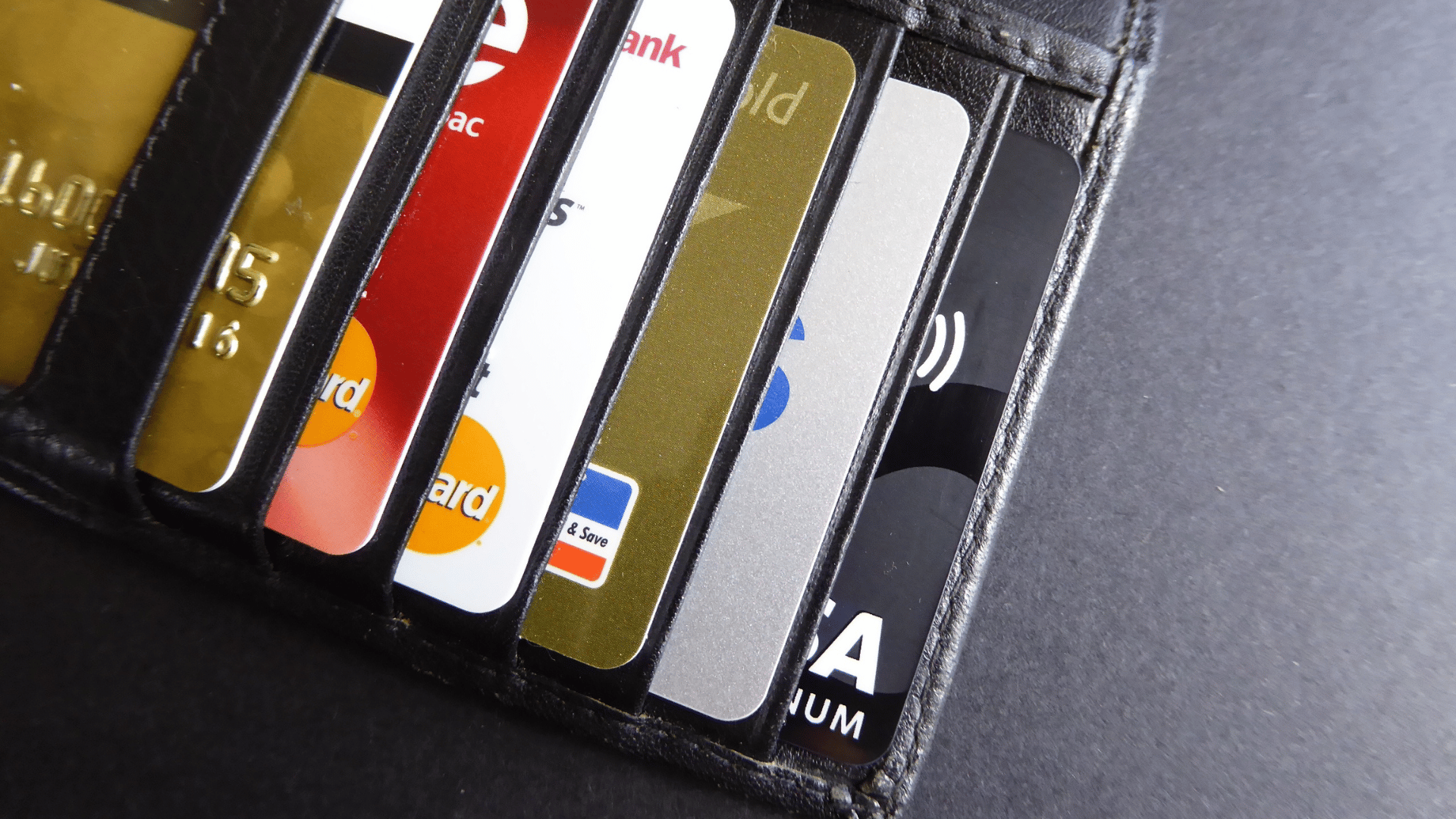 An image of small business owners wallet, showing a variety of credit cards.