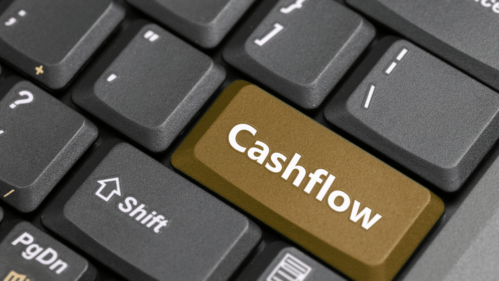 An image of a keyboard where the enter key has been replaced with a cash flow key.