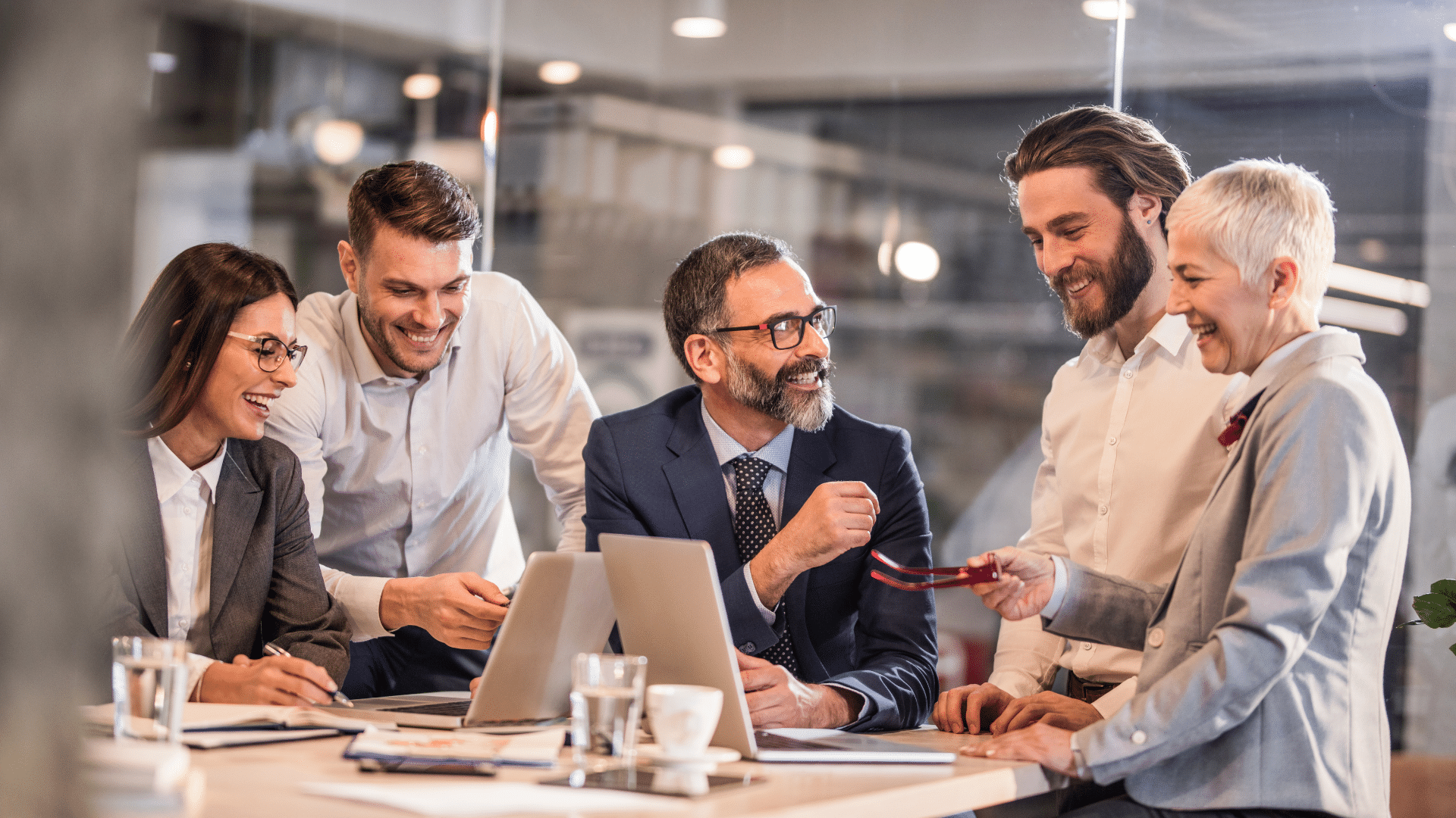 An image of a team meeting where they are discussing the financial health of their business.